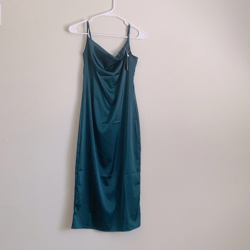 Teal, mid-length spaghetti strapped dress.